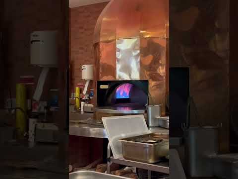 Beautiful copper pizza 🍕 fire oven in Italian restaurant Chiang Mai Thailand